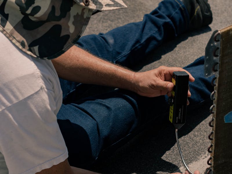 Professional AC repair technician fixing outdoor air conditioning unit